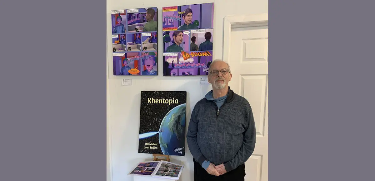 Job with his artwork on view at the Peter Salmon Art Center.